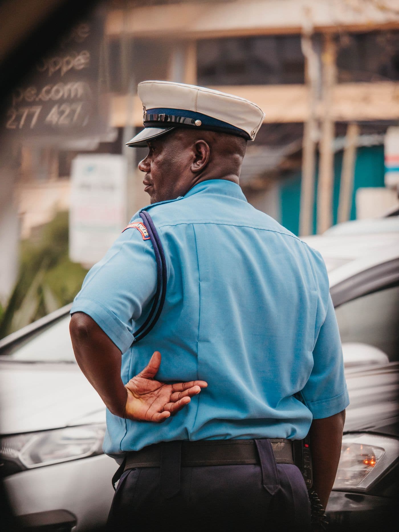 Kenyan police officer directing traffic — IoT-enabled law enforcement across Africa